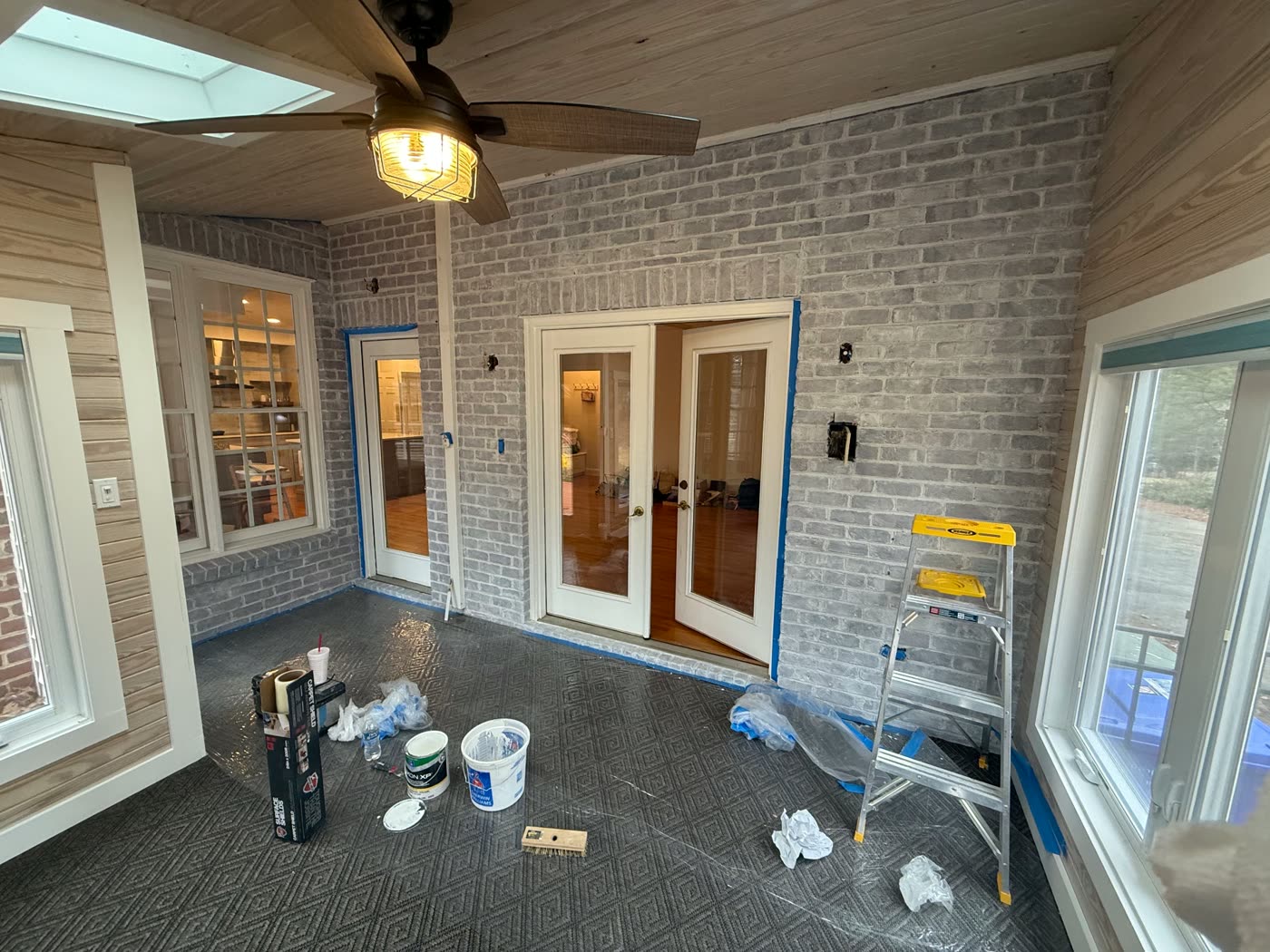 Screened brick porch masked and prepped for interior painting