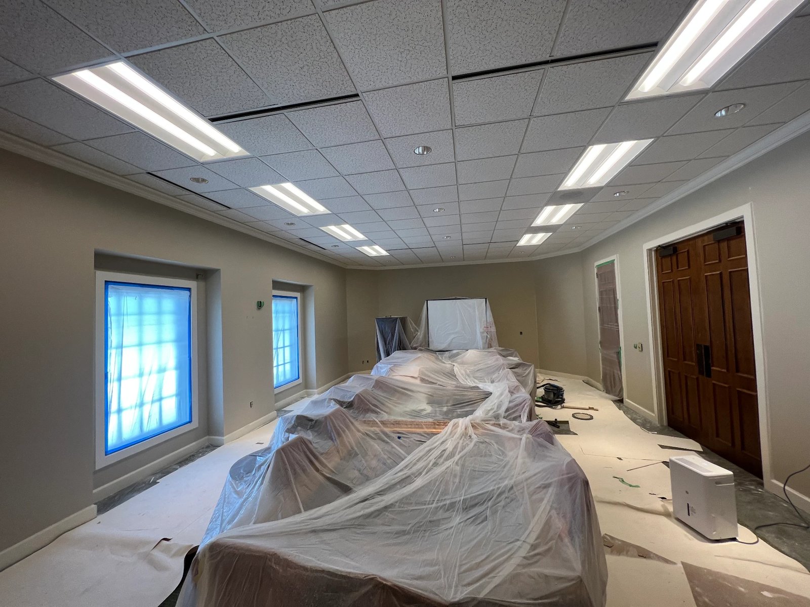 Conference room fully masked with plastic before repainting