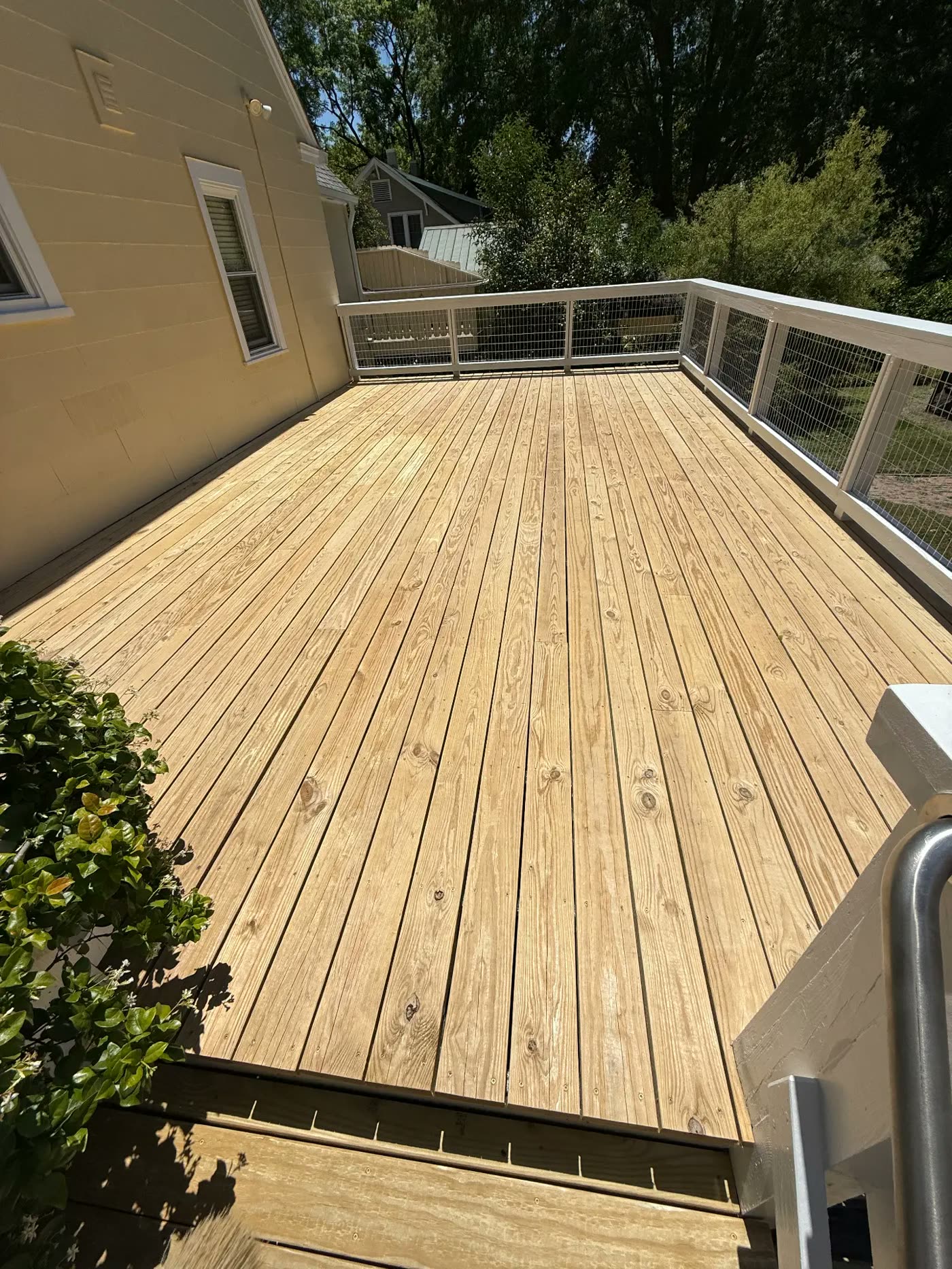 Deck boards cleaned and prepped before staining