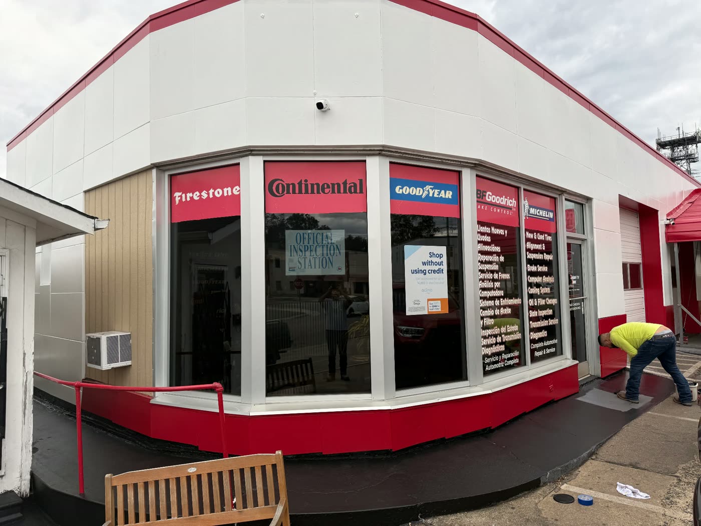 Commercial auto shop repainted in crisp white with bold red accents